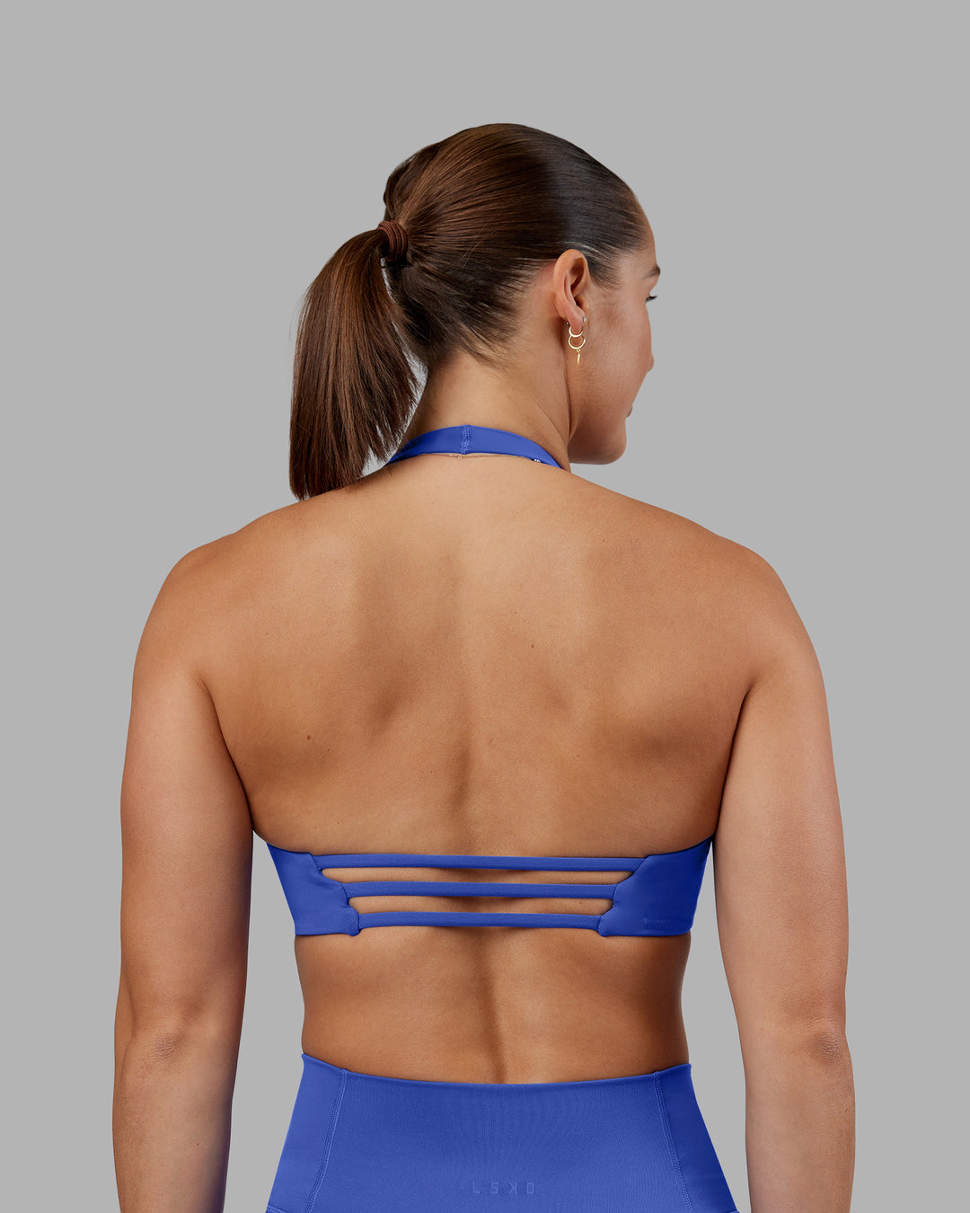 Woman wearing Abs Agile Halter Sports Bra - Power Cobalt | Model:Abbey | Size:S