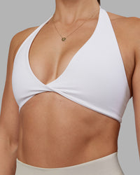 Woman wearing Abs Agile Halter Sports Bra - White | Model:Abbey | Size:S