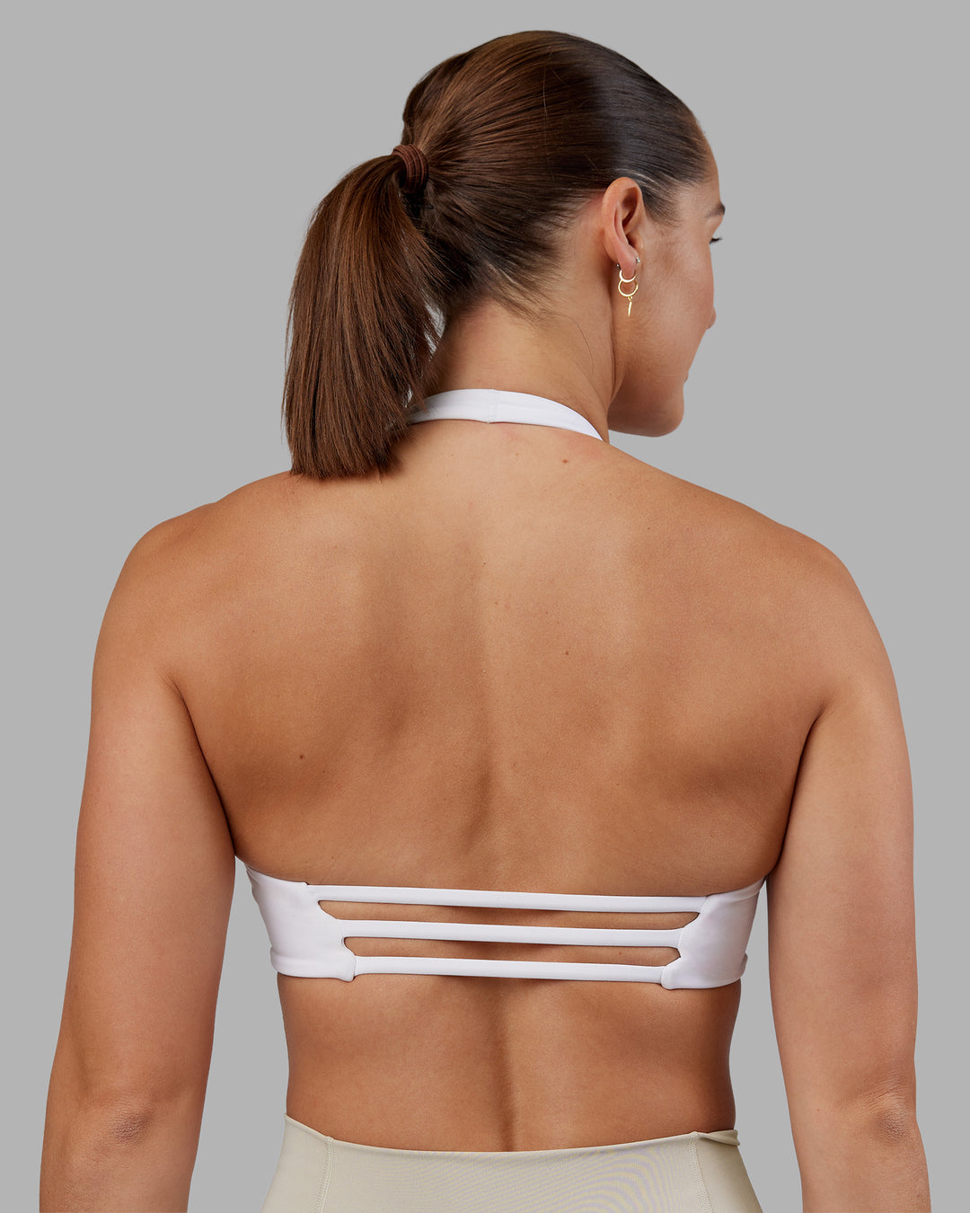 Woman wearing Abs Agile Halter Sports Bra - White | Model:Abbey | Size:S