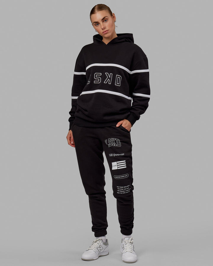 Woman wearing Unisex Academy Track Pant - Black