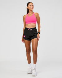 Woman wearing Accelerate 3" High-Rise Running Short - Black-Enjoy The Journey | Model:Rhiley | Size:S