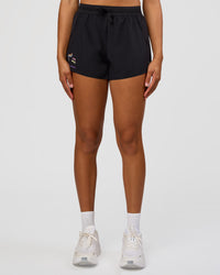 Woman wearing Accelerate 3" High-Rise Running Short - Black-Radiate | Model:Rosie | Size:S