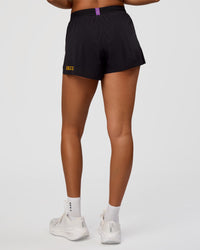 Woman wearing Accelerate 3" High-Rise Running Short - Black-Radiate | Model:Rosie | Size:S
