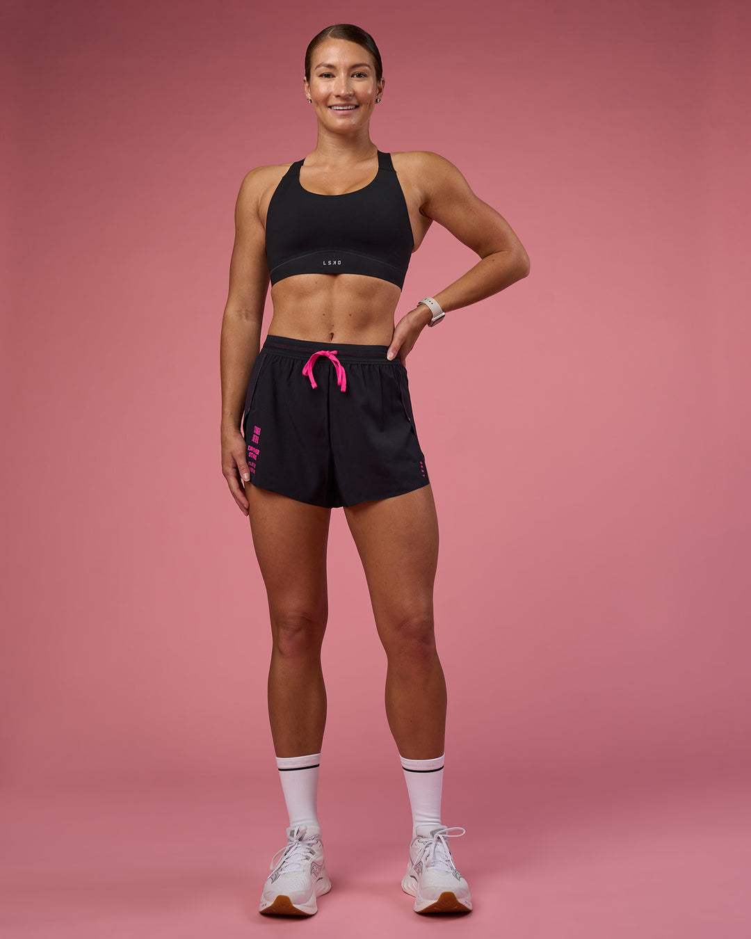 Woman wearing Accelerate 3&quot; High-Rise Running Short - Black-Ultra Pink | Model:Hannah | Size:S