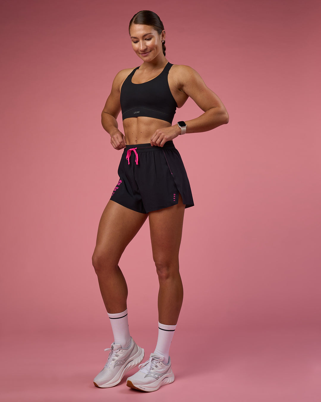 Woman wearing Accelerate 3&quot; High-Rise Running Short - Black-Ultra Pink | Model:Hannah | Size:S
