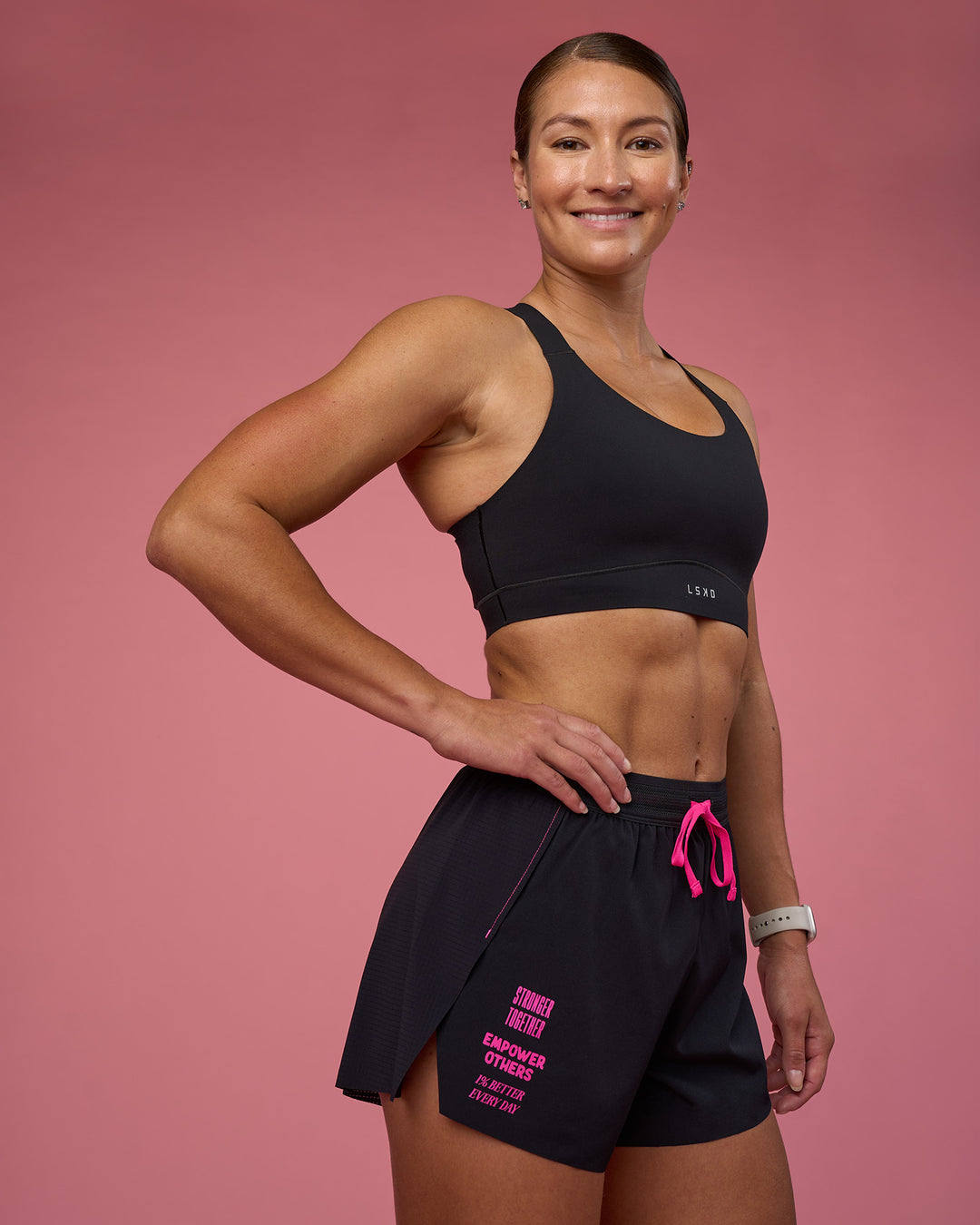 Woman wearing Accelerate 3&quot; High-Rise Running Short - Black-Ultra Pink | Model:Hannah | Size:S