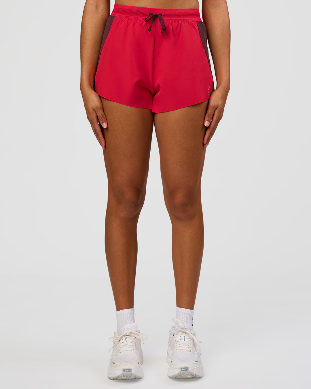 Woman wearing Accelerate 3" High-Rise Running Short - Cherry Lacquer-Scarlet | Model:Rosie | Size:S |
