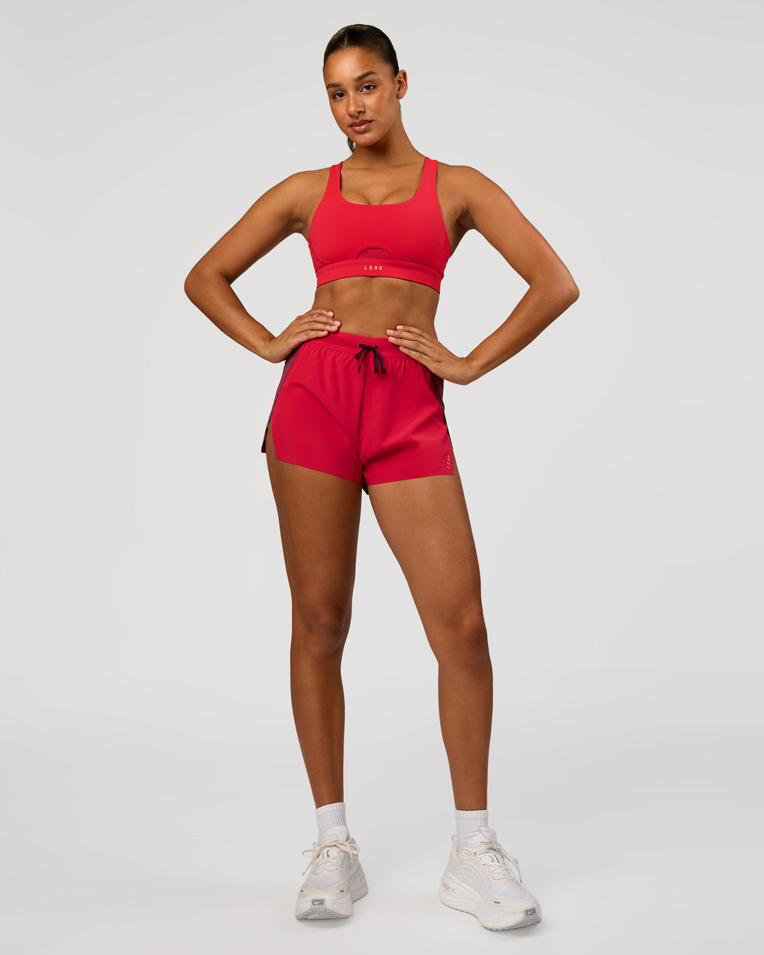 Woman wearing Accelerate 3" High-Rise Running Short - Cherry Lacquer-Scarlet | Model:Rosie | Size:S |