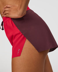 Woman wearing Accelerate 3" High-Rise Running Short - Cherry Lacquer-Scarlet | Model:Rosie | Size:S |