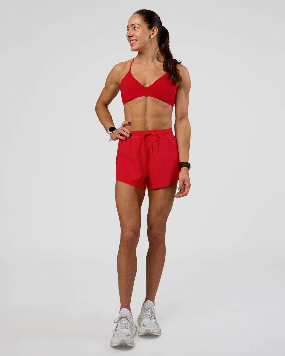 Woman wearing Accelerate 3&quot; High-Rise Running Short - Flame | Model:Zara | Size:S