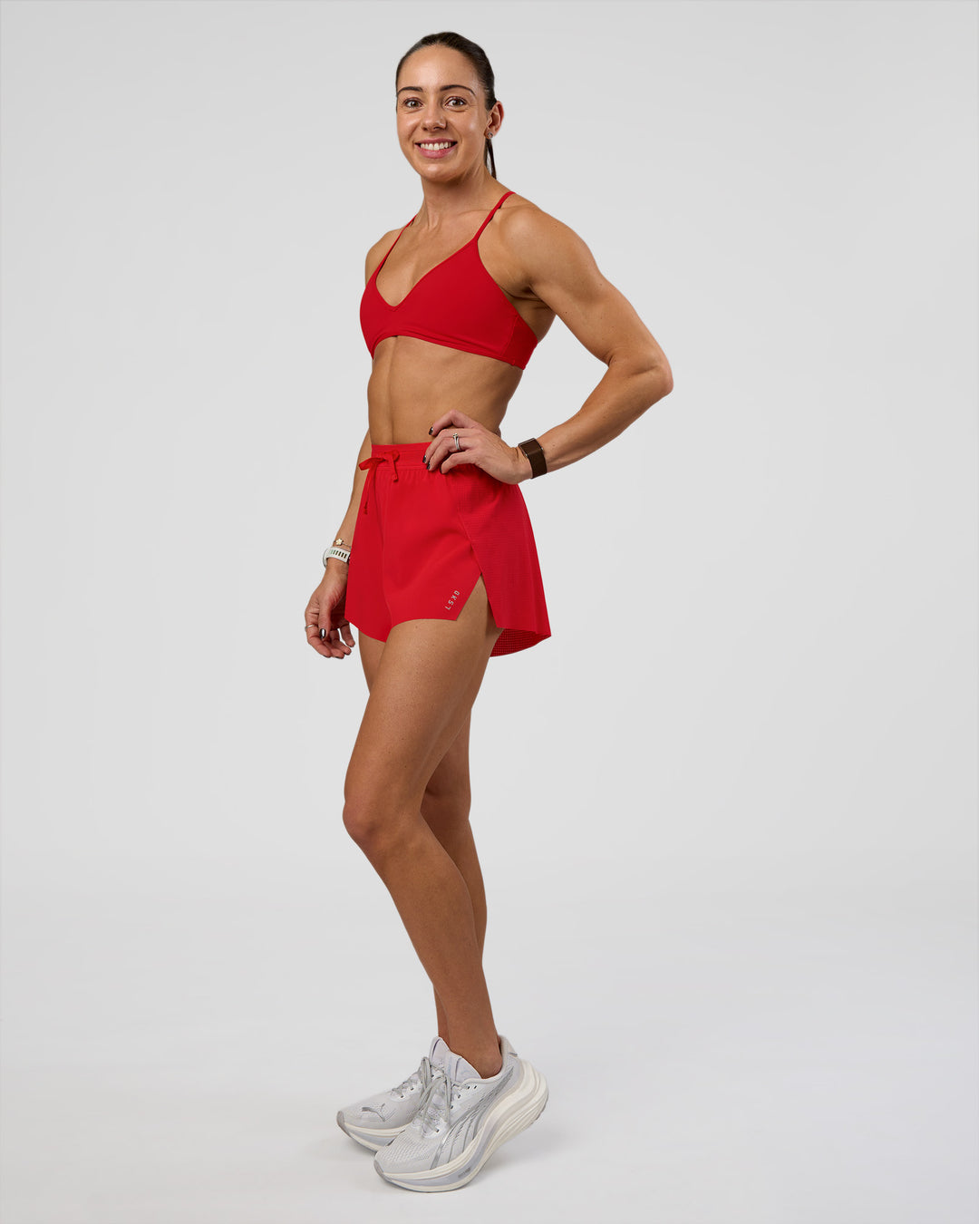 Woman wearing Accelerate 3&quot; High-Rise Running Short - Flame | Model:Zara | Size:S