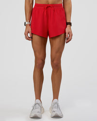 Woman wearing Accelerate 3" High-Rise Running Short - Flame | Set:true | Angle:front | Model:Zara | Size:S