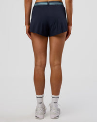 Woman wearing Accelerate 3" High-Rise Running Short - Future Navy-Baltic Sea | Set:true | Angle:back | Model:Evie | Size:S