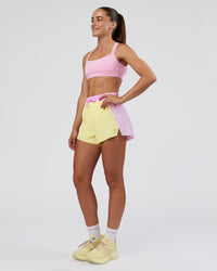 Woman wearing Accelerate 3" High-Rise Running Short - Marshmallow-Lemon | Model:Grace | Size:S