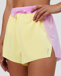 Woman wearing Accelerate 3" High-Rise Running Short - Marshmallow-Lemon | Set:true | Angle:closeup | Model:Grace | Size:S