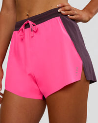 Woman wearing Accelerate 3" High-Rise Running Short - Midnight Plum-Sugar Plum | Model:Emelia | Size:S