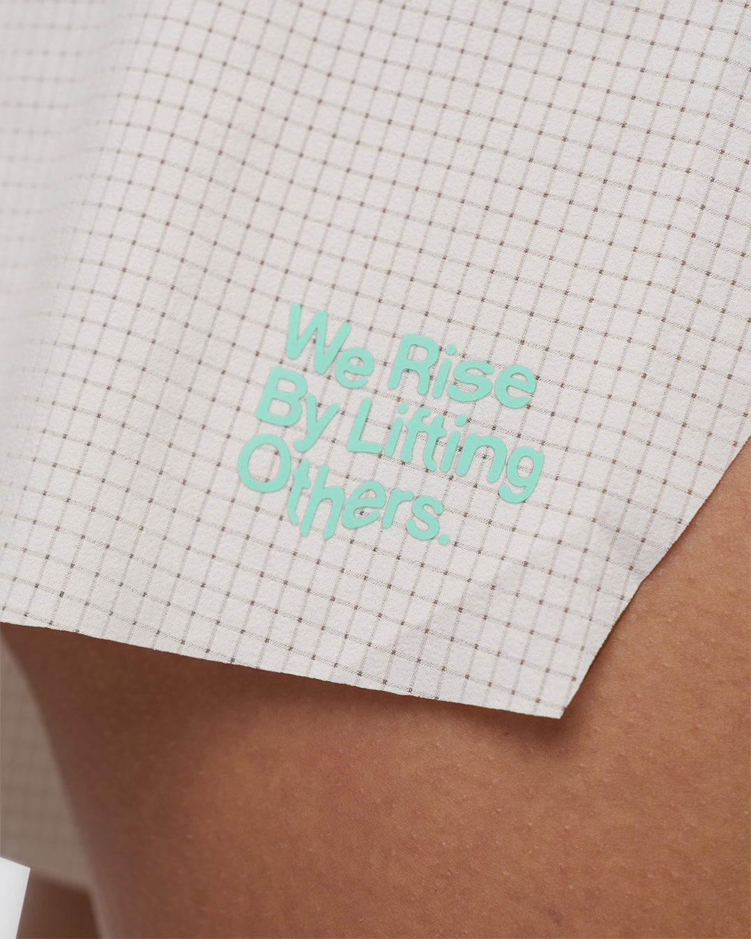 Woman wearing Accelerate 3&quot; High-Rise Running Short - Off White-Floral Sticker | Model:Abbey | Size:S