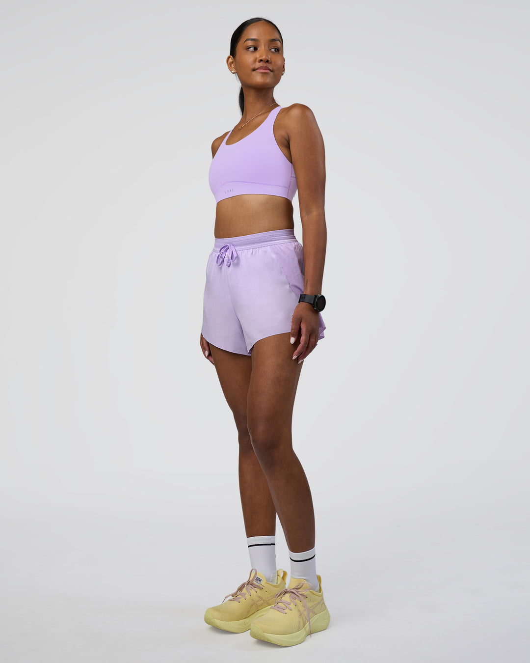 Woman wearing Accelerate 3&quot; High-Rise Running Short - Pale Lilac | Model:Rica | Size:S