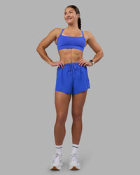 Woman wearing Accelerate 3" High-Rise Running Short - Power Cobalt | Model:Hannah | Size:S