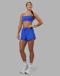 Woman wearing Accelerate 3" High-Rise Running Short - Power Cobalt | Model:Hannah | Size:S