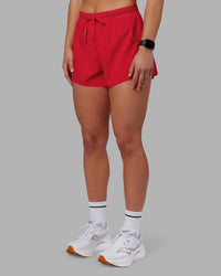 Woman wearing Accelerate 3" High-Rise Running Short - Scarlet | Set:true | Angle:side | Model:Keisha | Size:S