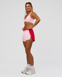 Woman wearing Accelerate 3" High-Rise Running Short - Scarlet-Marshmallow | Model:Amity | Size:S