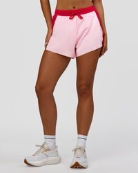 Woman wearing Accelerate 3" High-Rise Running Short - Scarlet-Marshmallow | Set:true | Angle:front | Model:Amity | Size:S