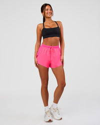 Woman wearing Accelerate 3" High-Rise Running Short - Sugar Plum | Model:Bianca | Size:S