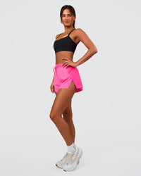 Woman wearing Accelerate 3" High-Rise Running Short - Sugar Plum | Set:true | Angle:side | Model:Bianca | Size:S