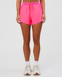 Woman wearing Accelerate 3" High-Rise Running Short - Sugar Plum | Set:true | Angle:front | Model:Bianca | Size:S