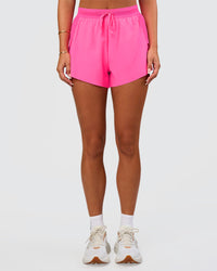 Woman wearing Accelerate 3" High-Rise Running Short - Sugar Plum | Set:true | Angle:side | Model:Bianca | Size:S