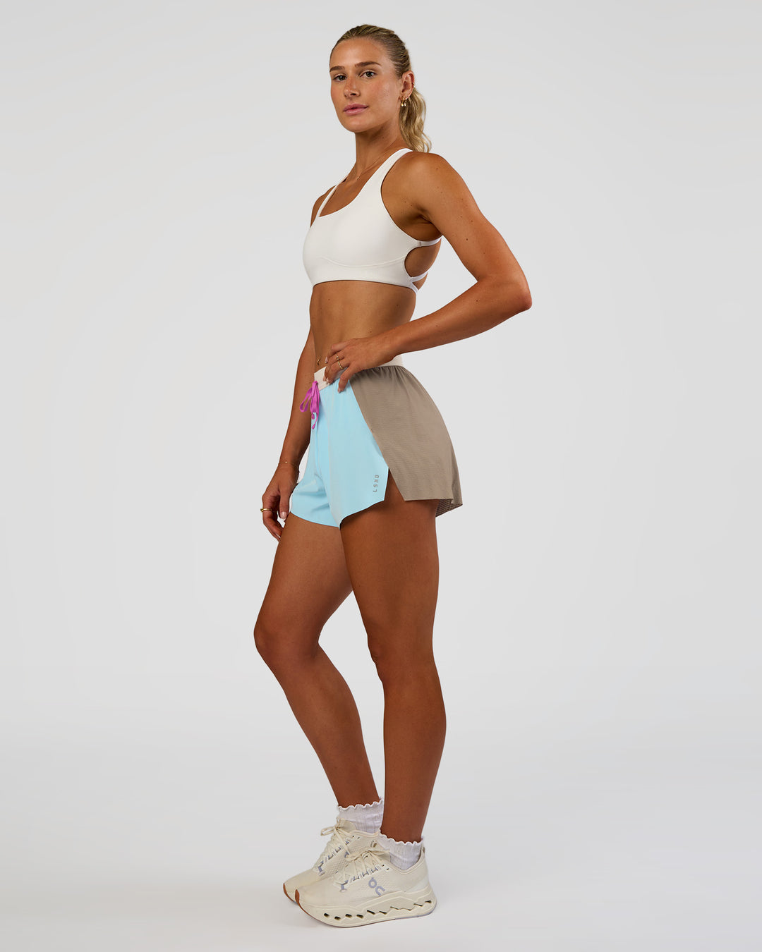 Woman wearing Accelerate 3" High-Rise Running Short - Taupe Ash-Glacial Blue | Model:Emelia | Size:S