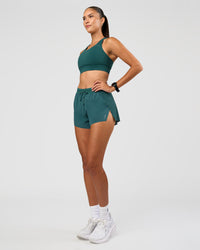 Woman wearing Accelerate 3" High-Rise Running Short - Transformative Teal | Model: Rhiley | Size:S
