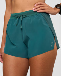 Woman wearing Accelerate 3" High-Rise Running Short - Transformative Teal | Set:true | Angle:closeup | Model: Rhiley | Size:S