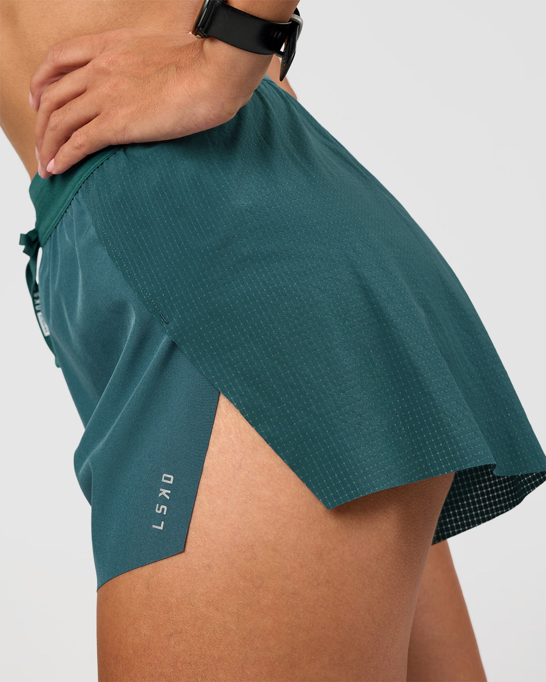 Woman wearing Accelerate 3" High-Rise Running Short - Transformative Teal | Model: Rhiley | Size:S