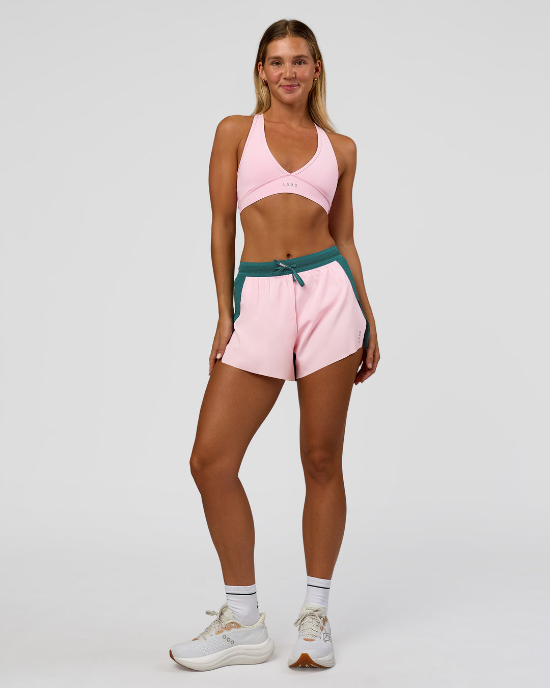 Woman wearing Accelerate 3" High-Rise Running Short - Transformative Teal-Marshmallow | Model:Amity | Size:S