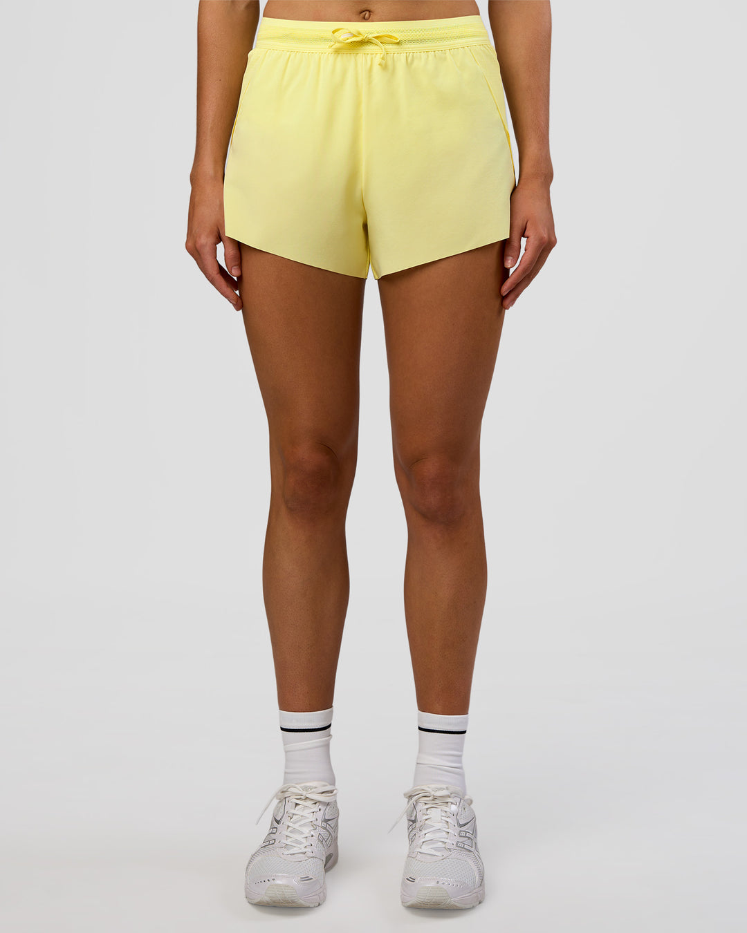 Woman wearing Accelerate 3&quot; High-Rise Running Short - Yellow Fizz | Model:Evie | Size:S