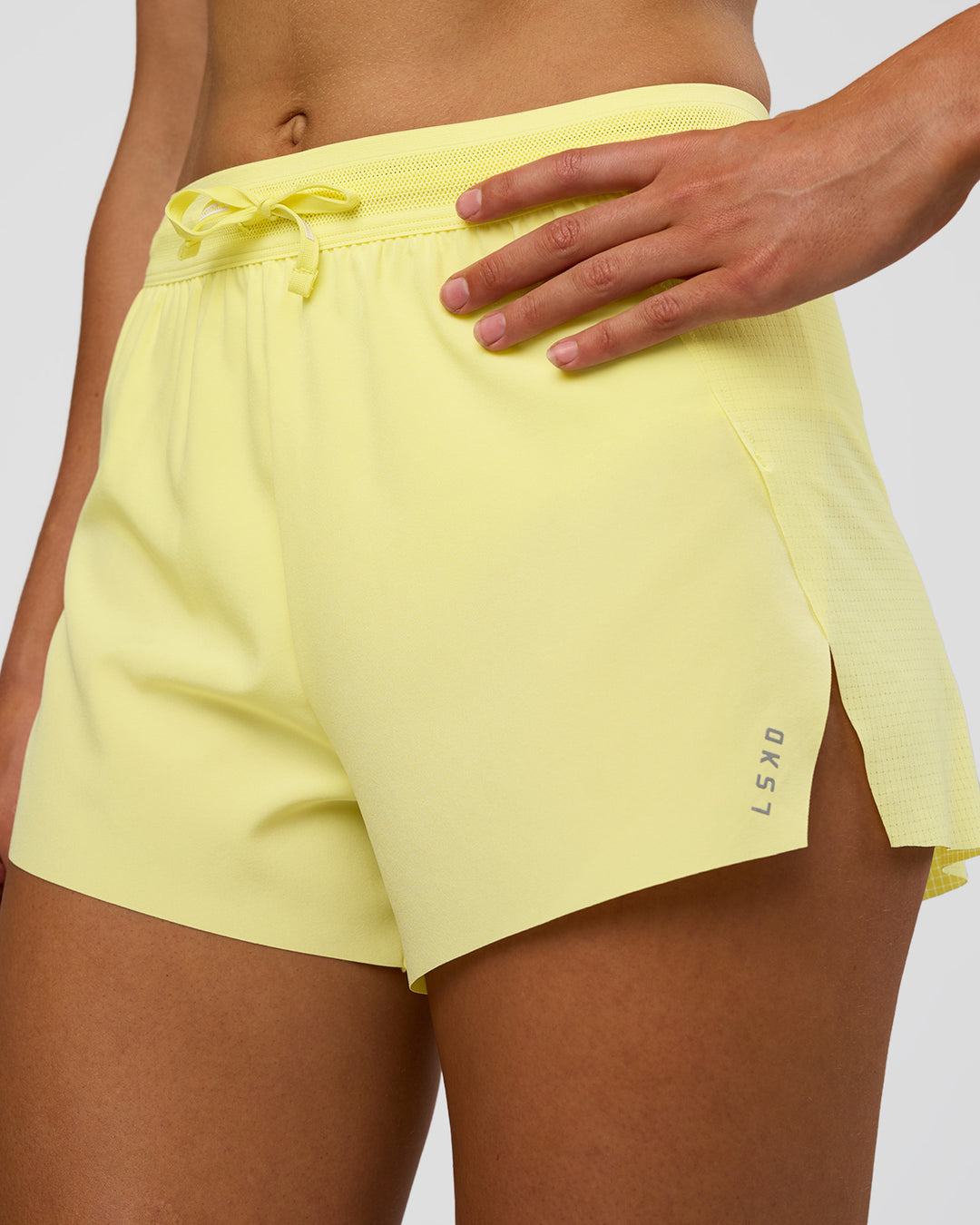 Woman wearing Accelerate 3&quot; High-Rise Running Short - Yellow Fizz | Model:Evie | Size:S