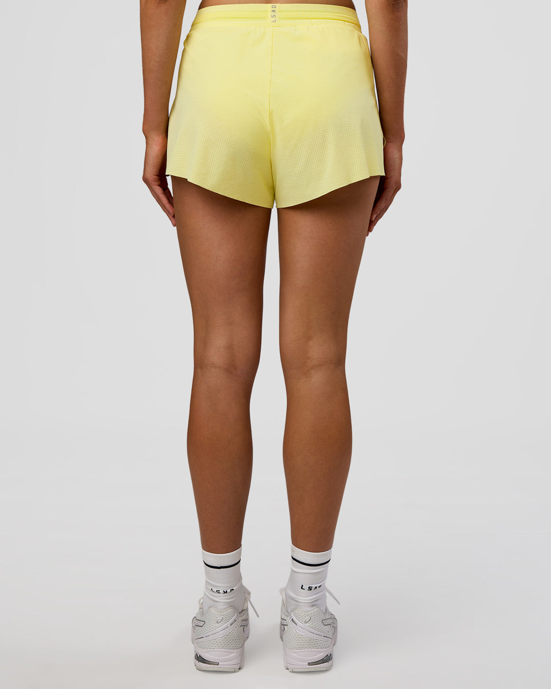 Woman wearing Accelerate 3&quot; High-Rise Running Short - Yellow Fizz | Model:Evie | Size:S