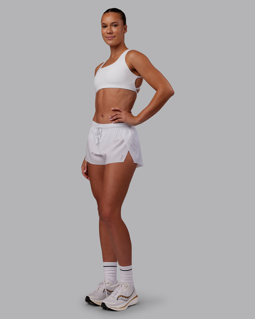 Woman wearing Accelerate 3&quot; Running Short - White | Model:Charlize | Size:S
