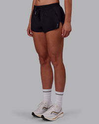 Woman wearing Accelerate 3" Running Short - Black | Set:true | Angle:side | Model:Charlize | Size:S