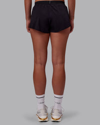 Woman wearing Accelerate 3" Running Short - Black | Set:true | Angle:back | Model:Charlize | Size:S