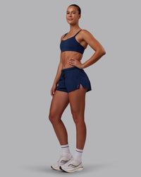 Woman wearing Accelerate 3" Running Short - Future Navy | Model:Charlize | Size:S
