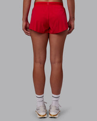 Woman wearing Accelerate Run Shorts - Scarlet | Set:true | Angle:back | Model:Charlize | Size:S