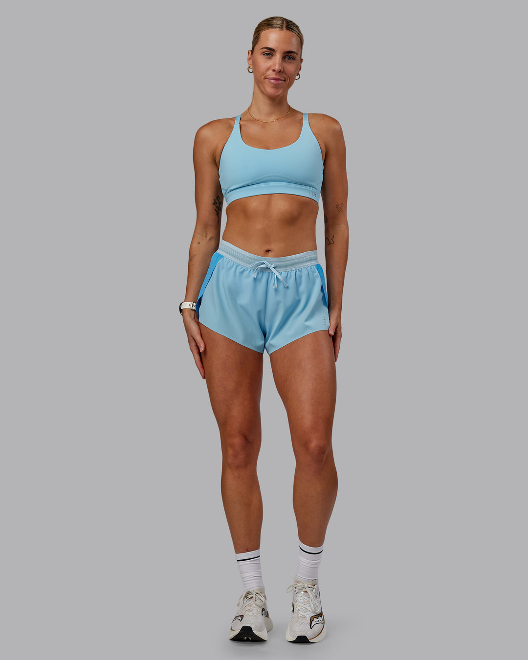Woman wearing Accelerate 3" Run Shorts - Sky Blue Colourblock