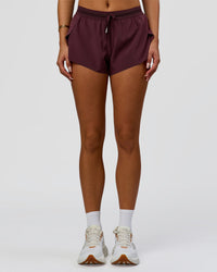Woman wearing Accelerate 3" Mid-Rise Running Short - Cherry Lacquer-| Model:Bianca| Size:S |