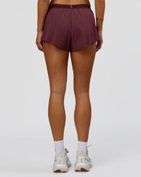 Woman wearing Accelerate 3" Mid-Rise Running Short - Cherry Lacquer-| Model:Bianca | Size:S |