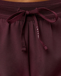 Woman wearing Accelerate 3" Mid-Rise Running Short - Cherry Lacquer-| Model:Bianca| Size:S |