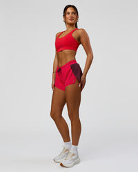 Woman wearing Accelerate 3" Mid-Rise Running Short - Cherry Lacquer-Scarlet | Model:Bianca | Size:S |