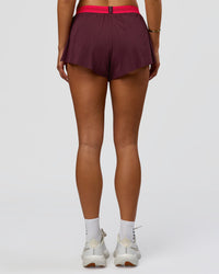 Woman wearing Accelerate 3" Mid-Rise Running Short - Cherry Lacquer-Scarlet | Model:Bianca | Size:S |